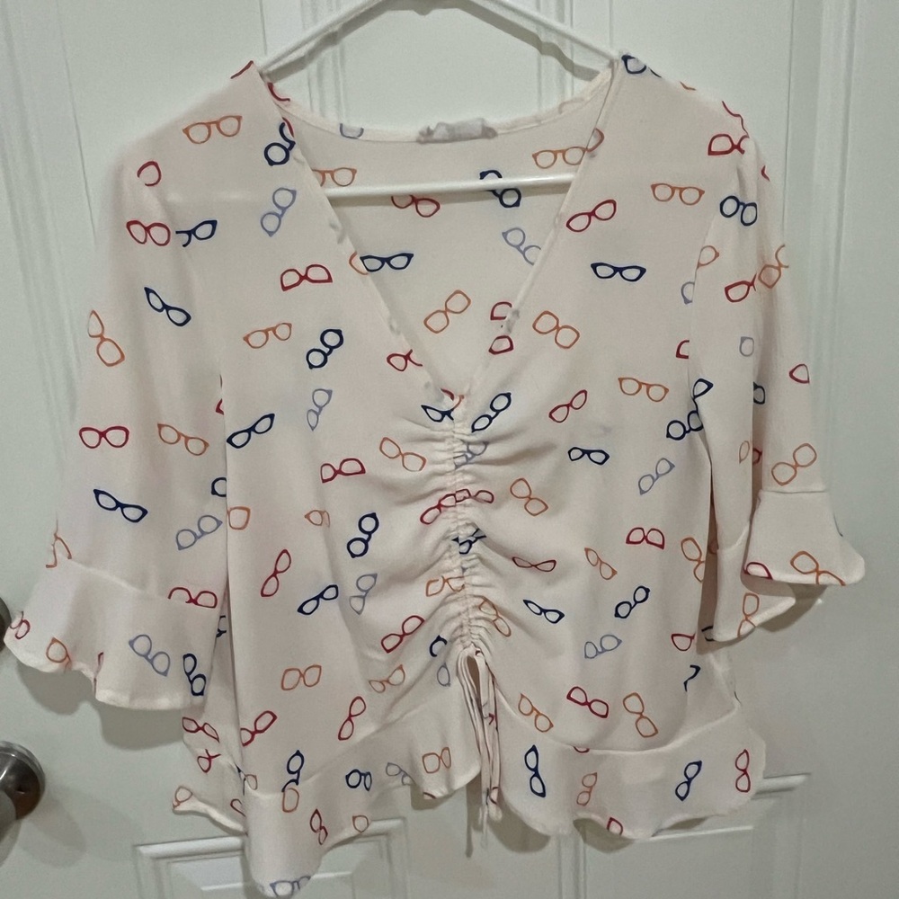 Elodie Cream Blouse with Flutter Sleeves and Ruffled Tie Front
